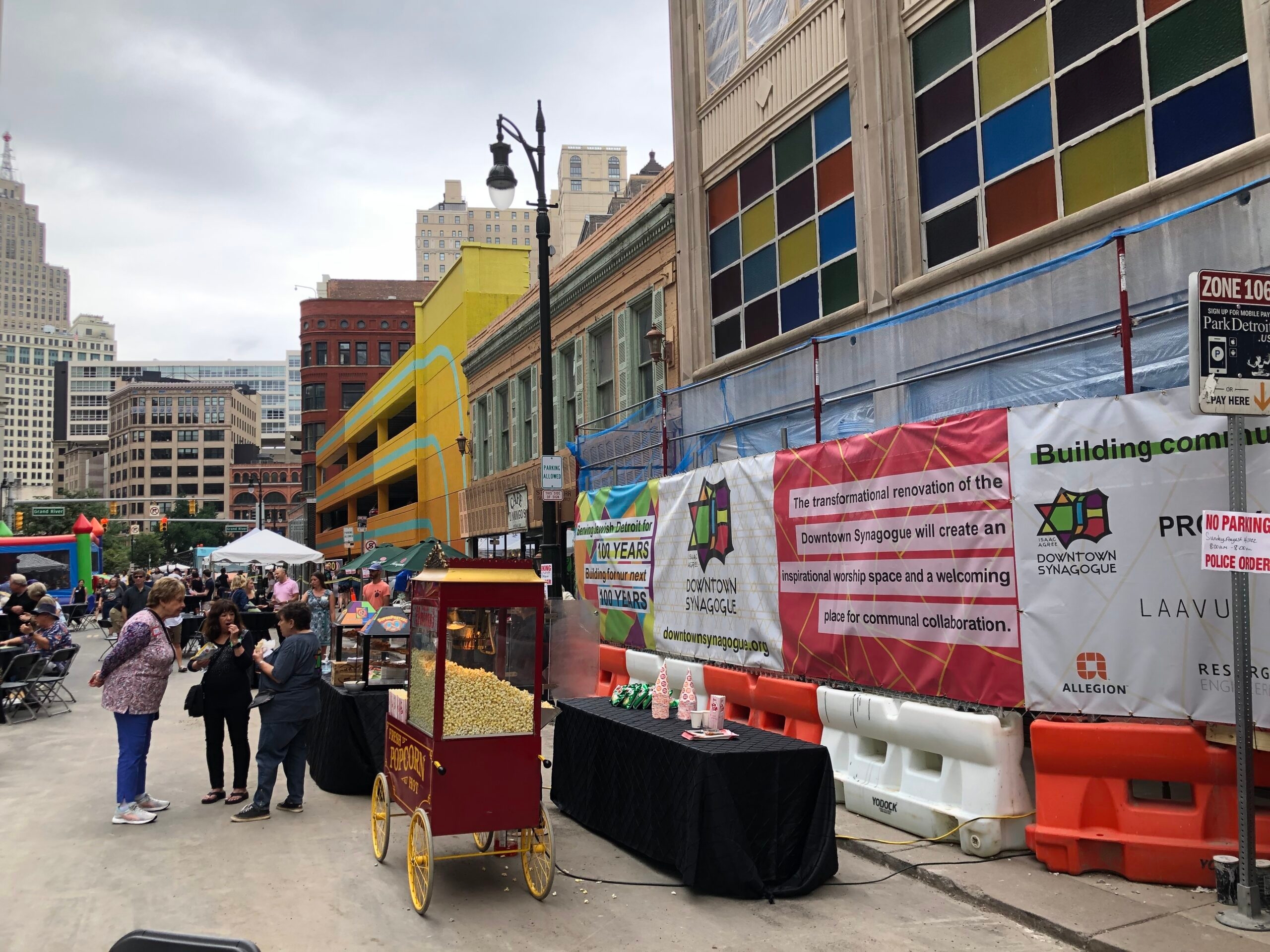 Crowds gather at a centennial block party.