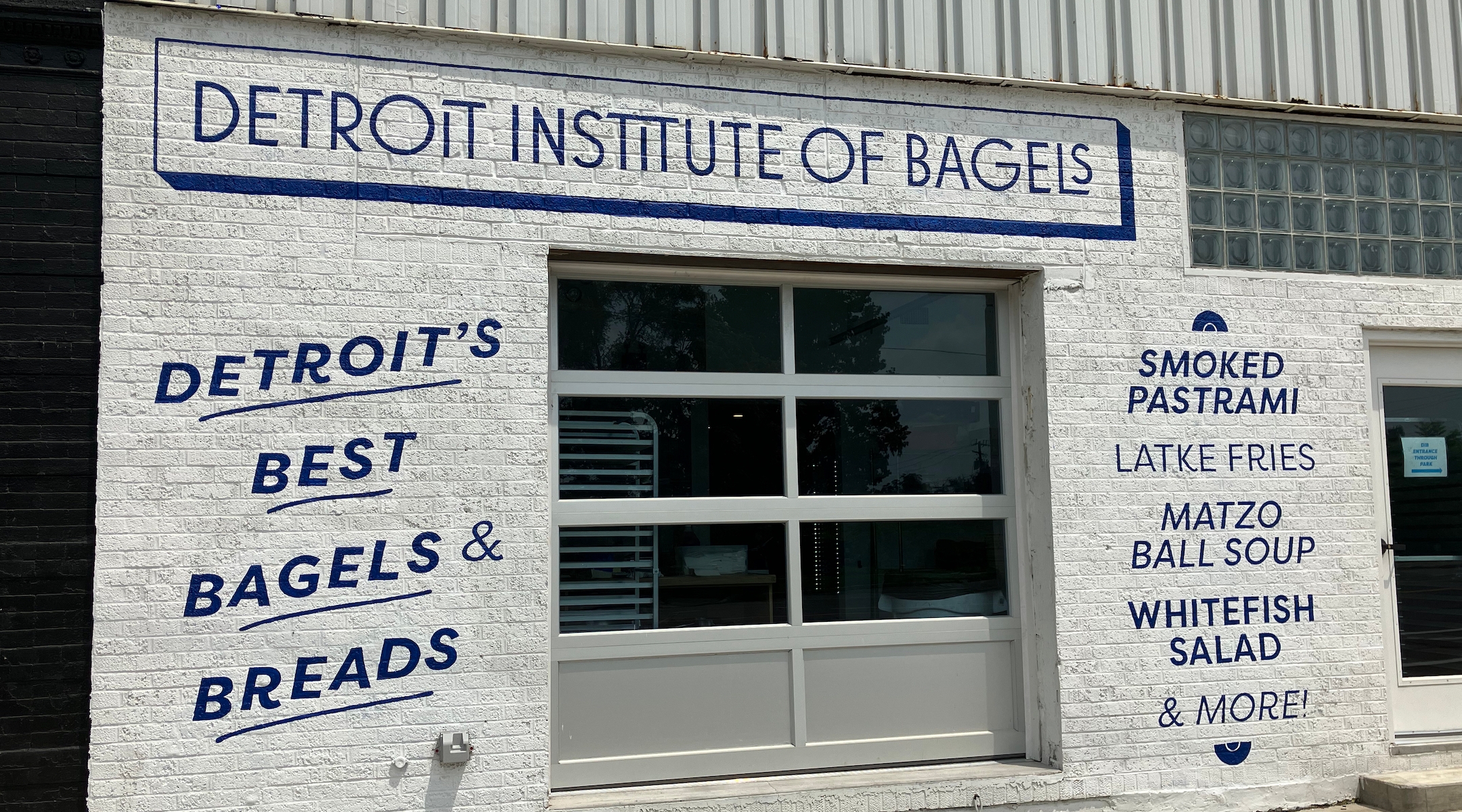 A closed storefront of a bagel shop